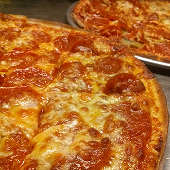 Inside Italian Village restaurant showing the famous wall-writing tradition with signatures from decades of customers and SIU students